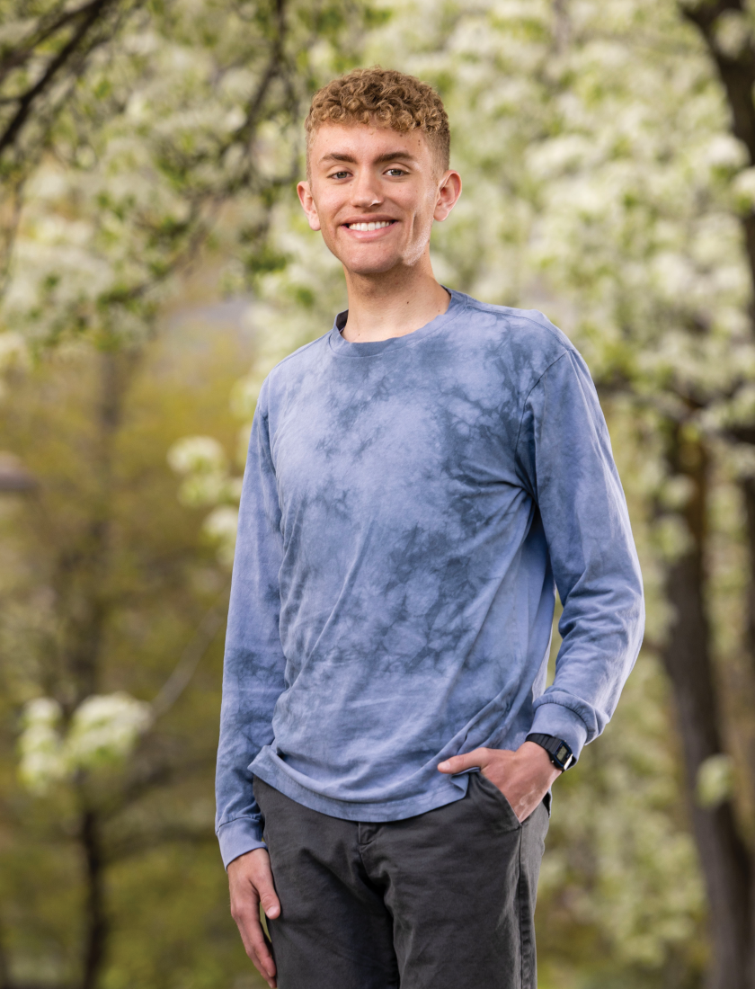 An image of Ethan Hardy in front of trees.