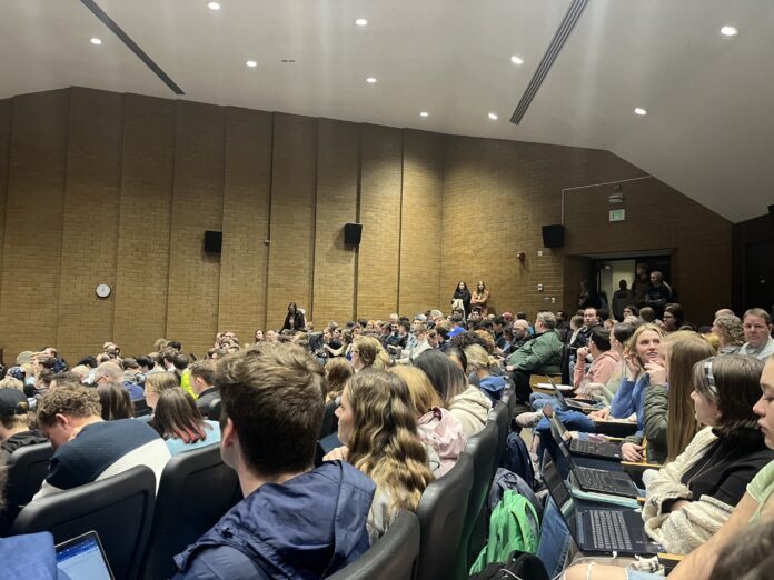 Student’s listen to Griffith’s lecture. Griffith’s speaking style had students both taking notes and laughing out loud.