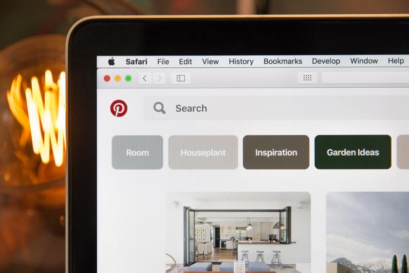 close-up shot of a laptop screen opened up to the Pinterest website on the Safari browser