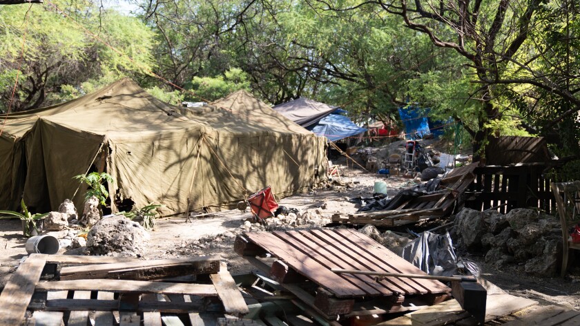 A couple of tents and wooden benches.