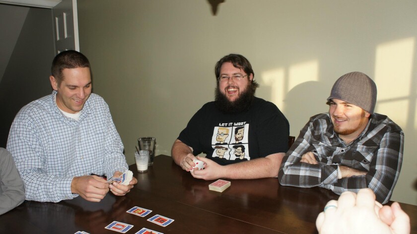 Many in James congregation consider him more than a pastor. Here, he plays games with fellow pastor Russ Robinson. (contributed by James Thompson)