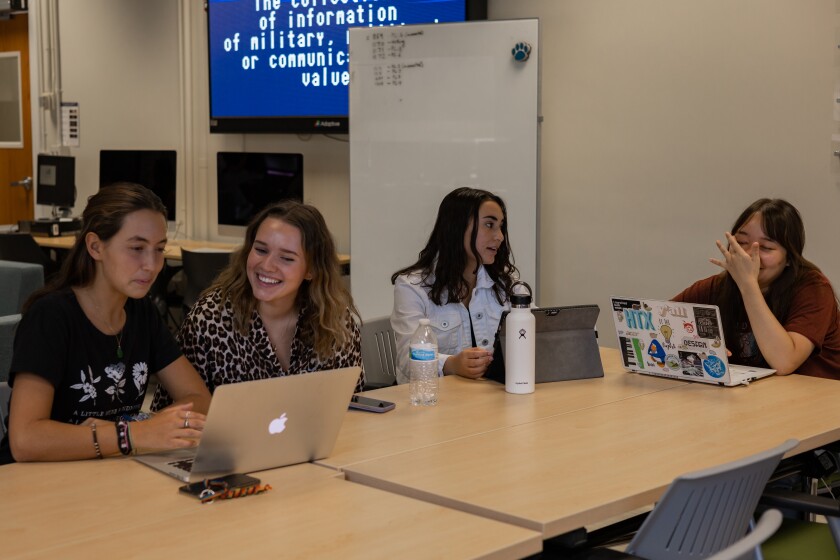 A typical day in the lab! A lot of collaboration goes on with team members, project managers, and more. Pictured (left to right): Josie Rackley, Anne Lincoln, and Emily Scanlan (me)
