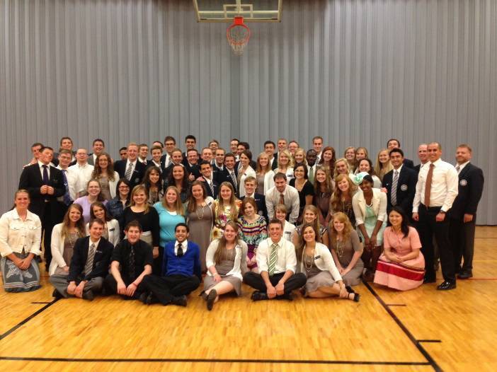 The folk dancers pose for a picture with the young single adult ward in O