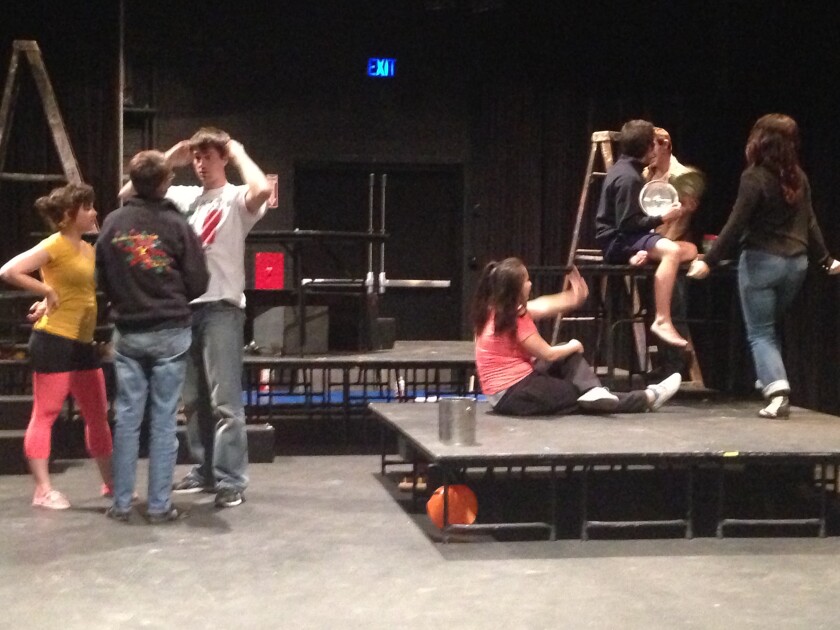 An image of some actors practicing backstage