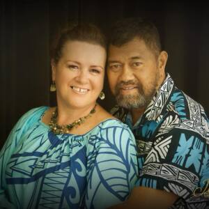 A portrait of Norris and Sheena Alaiasa smiling at the camera.