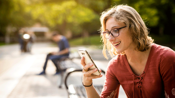 image of woman looking at cellphone