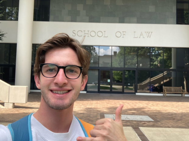 image of Gavin Cranney in front of School of Law