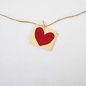 A photo of a heart hung on a string