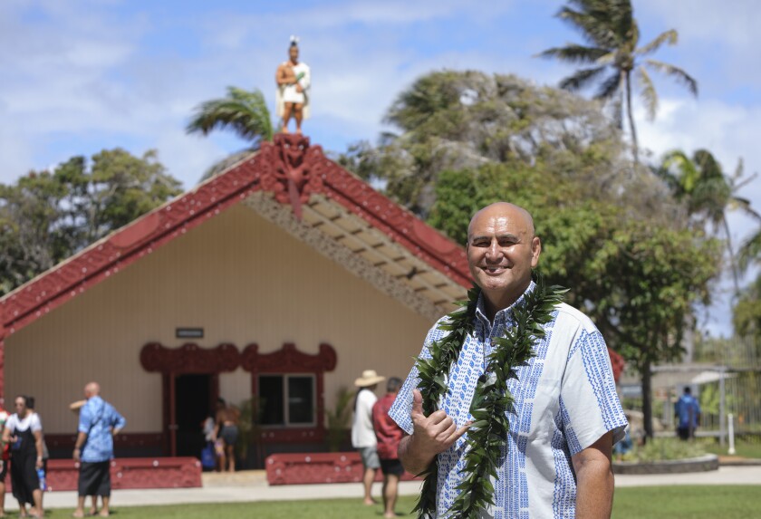 President Alfred Grace standing in front of the Aotearoa Village at the Polynesian cultural Center.