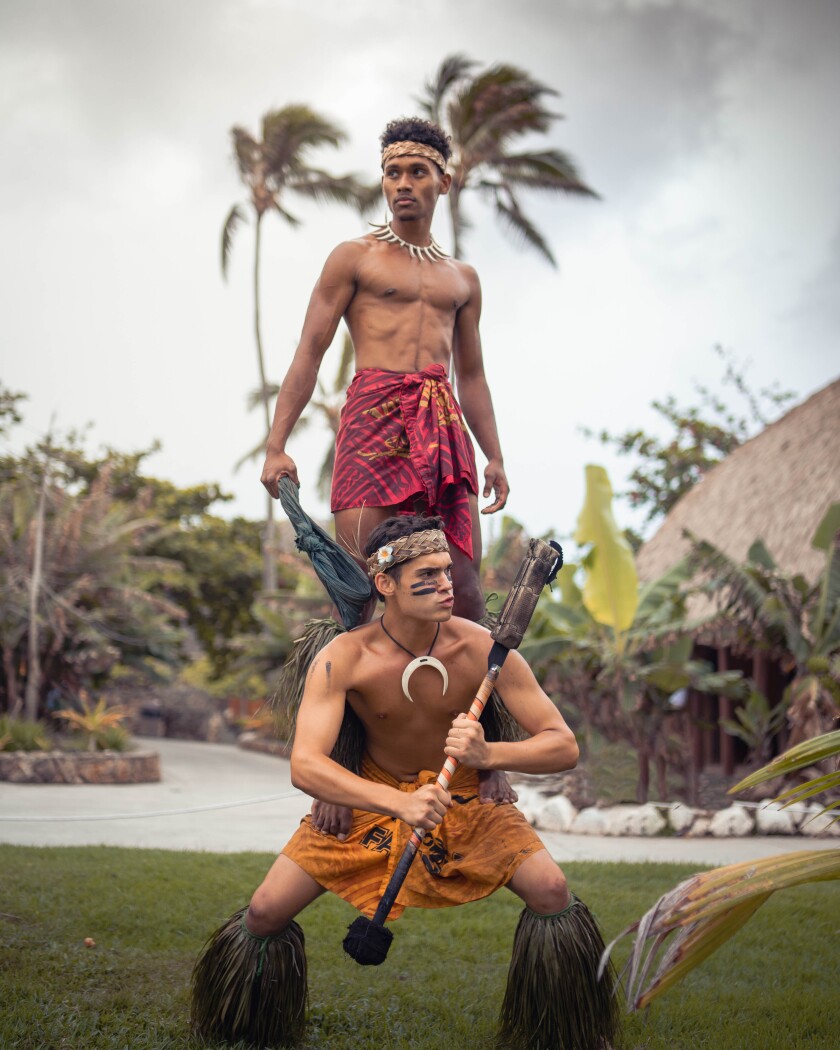 PCC Samoa Village workers posing in tradional attire.