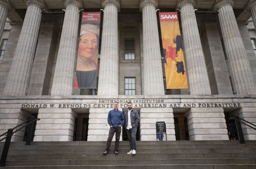 Paul Adams and Jordan Layton pose for a picture while standing on the steps of the Smithsonian Museum.jpg