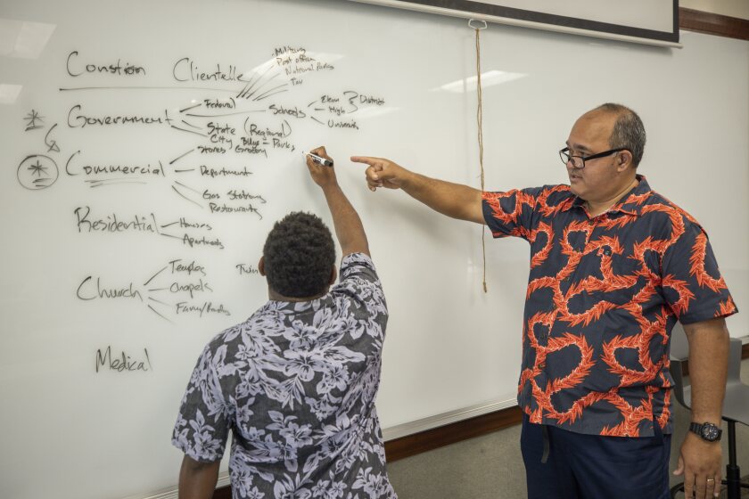 Professor Stone teaching a student in the classroom