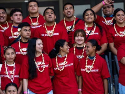 A group of new students smiling at each other