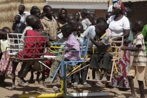 In this Thursday Nov. 27, 2014 photo, children displaced after attacks by Boko Haram, play in the camp of internal displaced people, in Yola, Nigeria. Seven children have been reunited with parents lost in the chaos of attacks in Nigeria