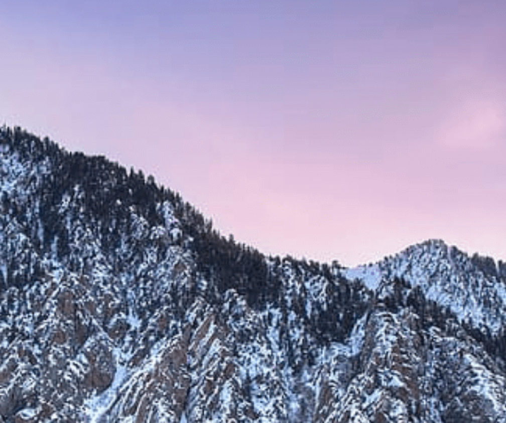 sunset background with snowy mountains
