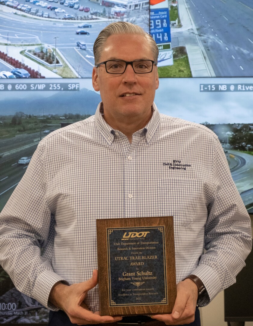 Dr. Schultz holding his award.