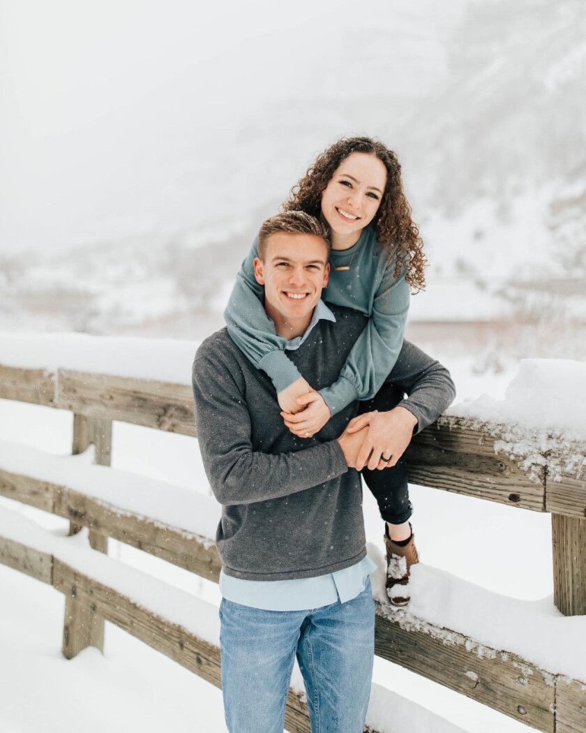 Photo of Katelyn Bell with her husband in a snowy landscape
