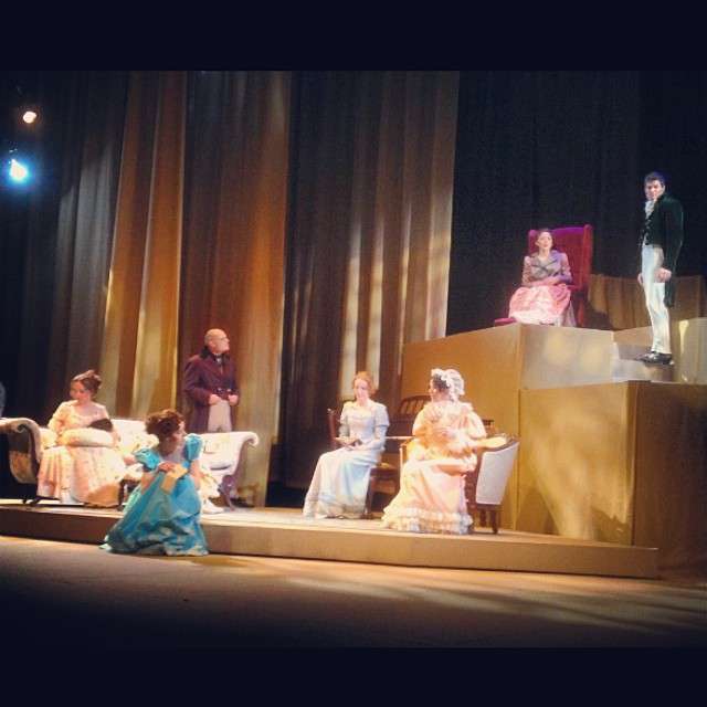 The actors portraying the Bennet family await lighting and sound cues to be finalized.