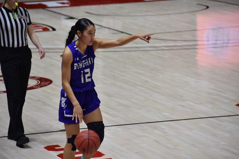Ameleya playing basketball in the court