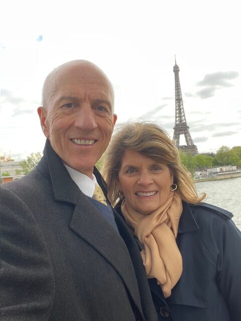 Karen Bybee and Her Husband, Jeff Holdaway, in Front of the Eiffel Tower in Paris, France