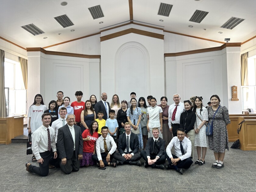 A group of members in Mongolia with President and Sister Kauwe.