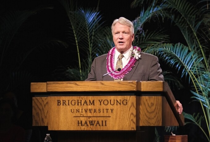 Stephen Owen stands at a podium that says Brigham Young University Hawaii.