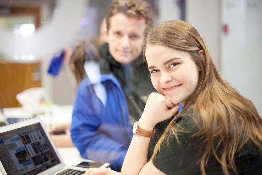 BYU students in class, female student has hand on chin