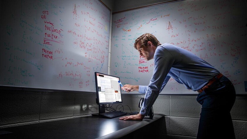 Student consults data on a computer screen