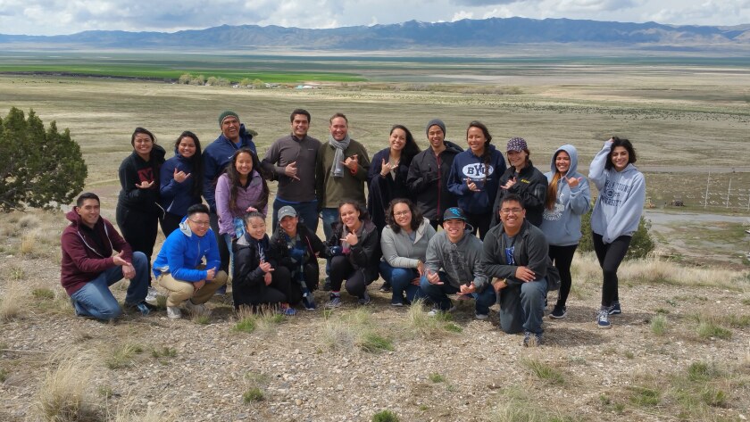 Student volunteers in the Hui Iosepa group who helped with the digitization scripture process Robert "Lono" Ikuwa in the center. A small town where Hawaiian saints settled named Iosepa, Utah is in the background.