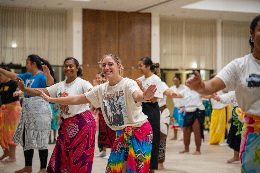 A group of ladies dancing.