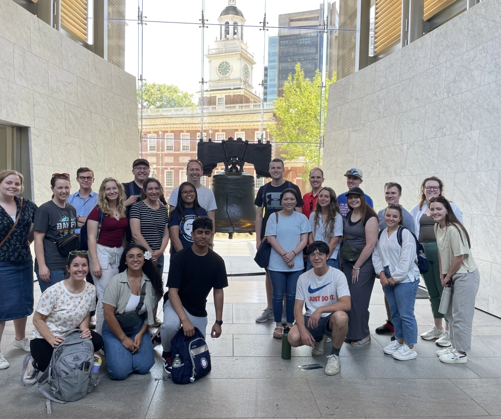 Group of student fellows in front of Liberty Bell.
