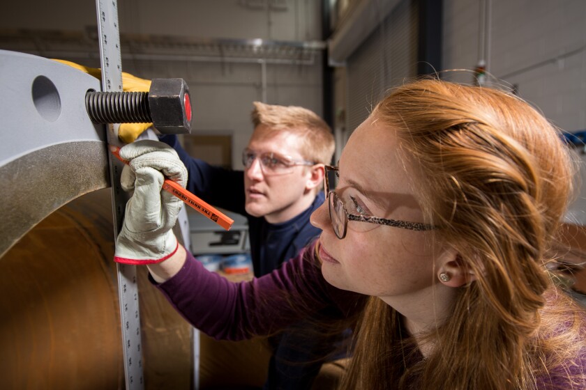 Students taking measurements in a lab