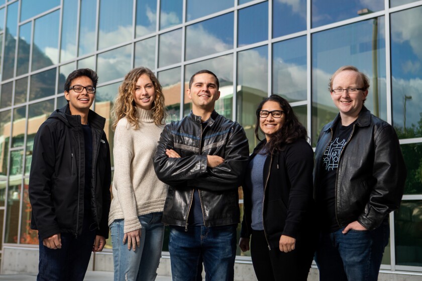 Kevin Bauer and his four student employees stand outside the Life Sciences Building
