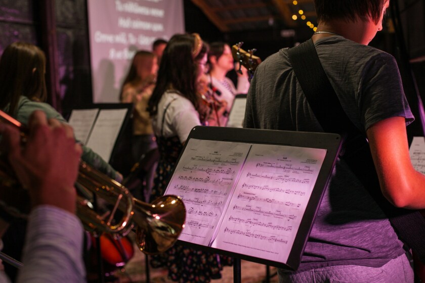A person playing saxophone.