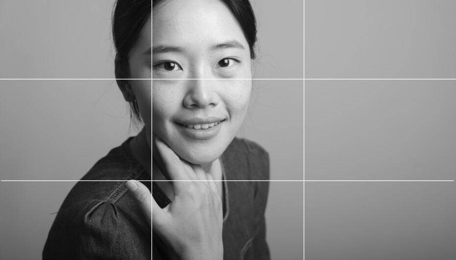 Woman posing with her hand below her chin