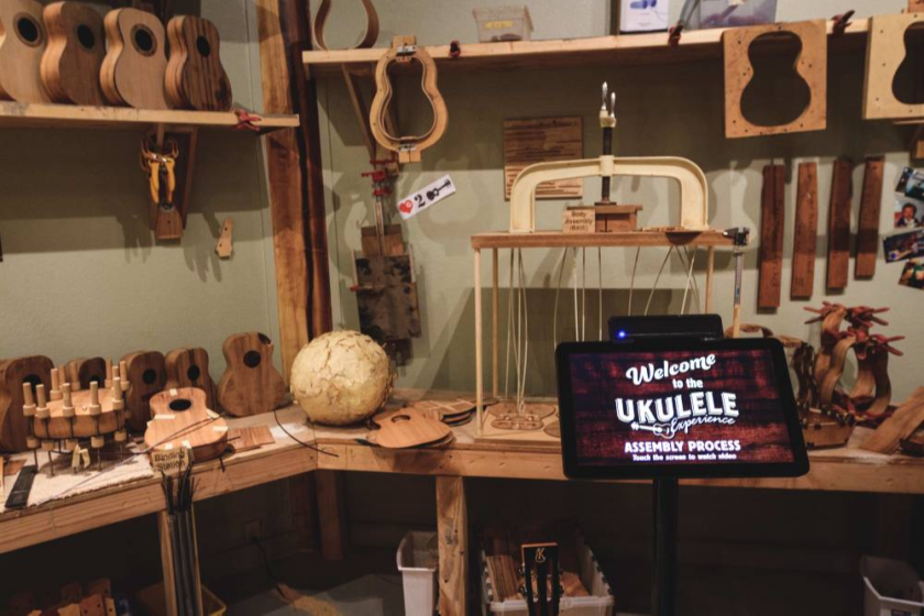 A ukulele woodshop with ukuleles in various stages of completion