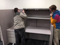 Moving Services removing a desk.