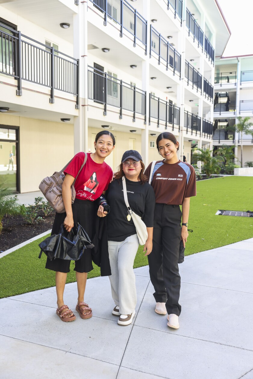 BYUH students standing in the Hale 11 courtyard.