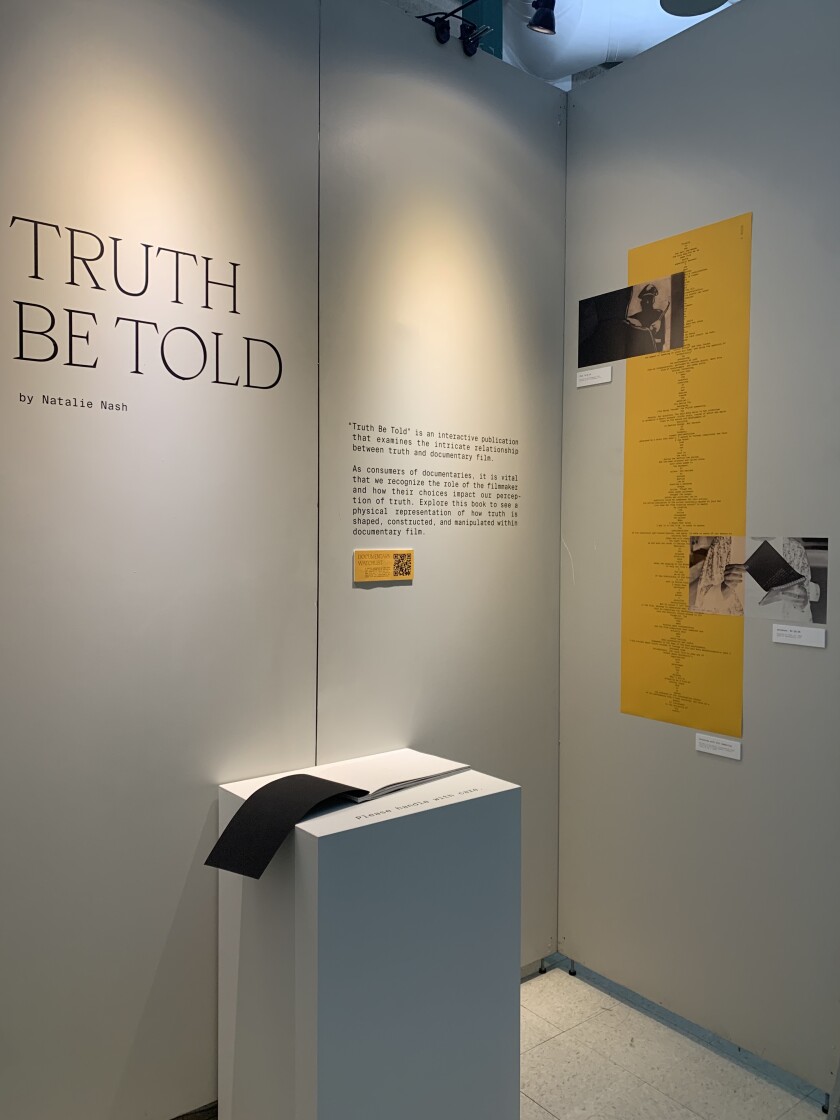 Natalie's physical project book is open for visitors, with her book on display.
