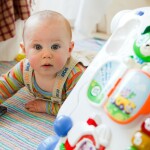 Baby playing on the floor.