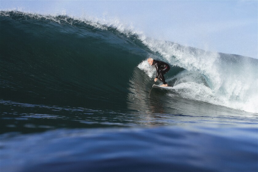 Kevin Smith surfing a large wave