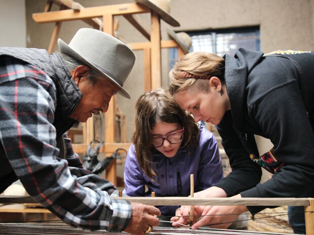Art Education students learning weaving