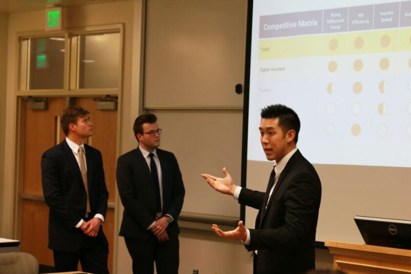 Lee Chang present to a board of judges from HP. (Michaela Proctor)