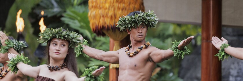 Meeprolam dancing hula with other performers.