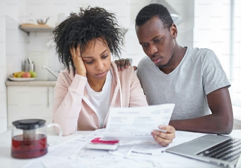 couple looking at a paper together