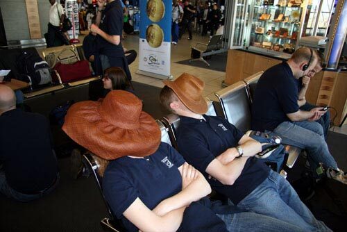 An image of students sleeping at the airport