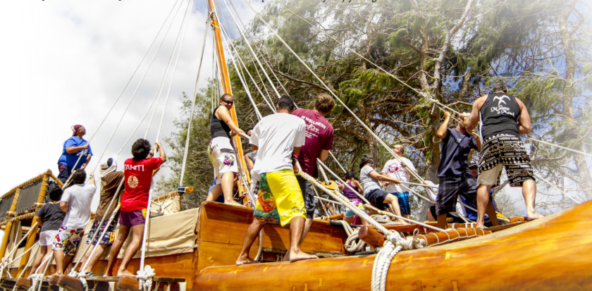 Iosepa crew pulling up the mast of the canoe