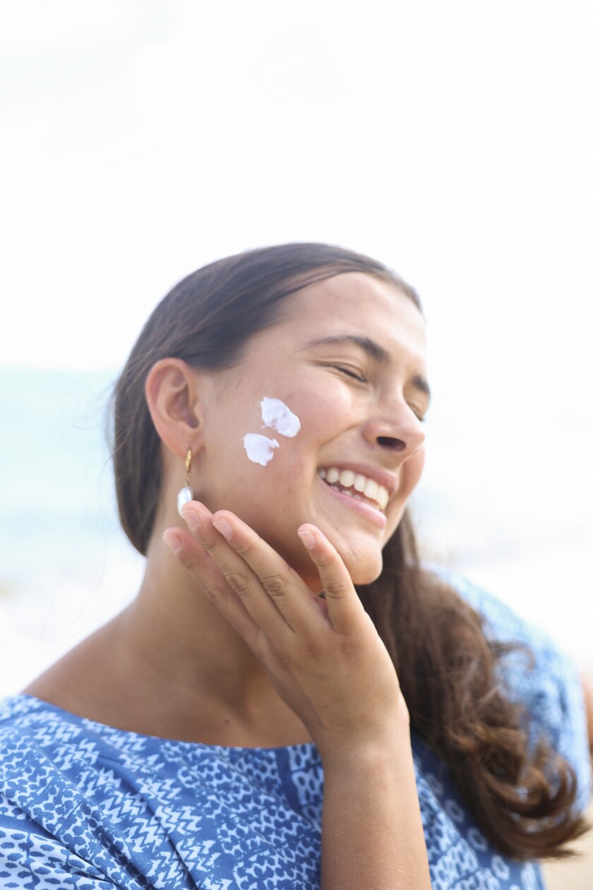 Lynae Lambert shows how to apply suncreen