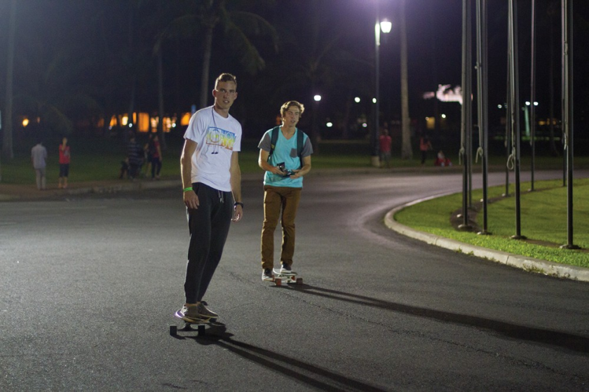 Two male students on skateboards