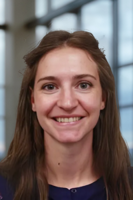 A headshot of a brunette female college student.